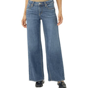 Blue jeans worn by a person on a white background